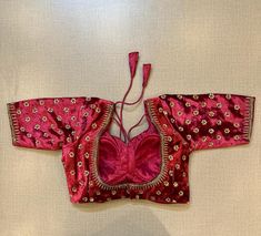 Beautiful maroon velvet embroiderd choli-cut saree blouse. Buy designer blouse in USA from Pure Elegance. Disclaimer: The actual product may vary slightly from the image. These are custom orders, hence expect slight variation in color, placement of the motif or buta. ESTIMATED DELIVERYBecause this is a custom order, it would take about 4 weeks from the date of purchase. RETURN POLICY: This product is a custom order and cannot be returned or exchanged.