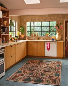 a kitchen with an area rug on the floor