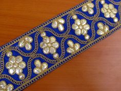 This is blue and golden embroidered Indian lace, border. Perfect for crafts, dresses, ceremonial dresses, saris,lehangas, costumes, home decoration etc. This is sewing lace, very easy to stitch on any back ground. It is embroidered with a very fine finish with golden thread using gota/ zari on blue art silk fabric. Lace has a symmetrical floral pattern all over. It is very light weight and ethnic in look. Width- 3.5 inch. For more such border and lace please visit- https://www.etsy.com/in-en/sho Embroidery Jeans Jacket, Lace Fancy, Sewing Lace, Golden Thread, Animal Print Scarf, Computerized Embroidery, Saree Border, Embroidery Designs Fashion, Crochet Applique