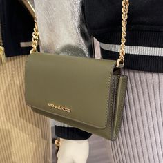 Michael Kors Jet Set Travel Medium Logo Smartphone Leather Crossbody Bag Olive Nwt New With The Tag Authentic Polished And Petite, Our Jet Set Travel Safiano Leather Smartphone Bag. Featuring Chain-Link Detailing For A Glamorous Spin, This Compact Crossbody Is Designed With Detachable Leather Strap For Days On The Go. Wear It Crossbody And Carry It As A Clutch, Depending On The Occasion. Crossbody Bag Safiano Leather Gold-Tone Hardware Exterior Details: Detachable Crossbody Strap Interior Detail Wallet On Chain With Branded Hardware For Everyday Use, Travel Wallet On Chain Shoulder Bag, Travel Crossbody Bag With Gold-tone Hardware, Green Michael Kors Crossbody Bag, Michael Kors Jet Set Large Crossbody Bag, Smartphone Bag, White Crossbody Bag, Michael Kors Crossbody Bag With Gold-tone Hardware, Michael Kors Bags With Gold-tone Hardware