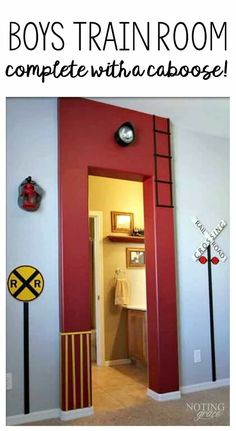 the hallway is painted red and white with railroad crossing signs on the wall next to it