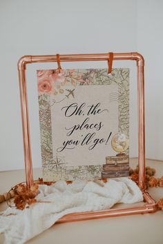 there is a sign that says oh the places you'll go with flowers on it