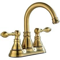 a golden faucet with two handles