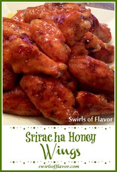 some chicken wings on a white plate with the words sriracha honey wings over it