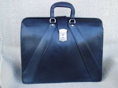 Classic ,Top Open,Valise style ,briefcase made from top quality USA tanned bridle leather.Also sometimes refered to as a Lawyers Briefcase,this beautiful, but rugged case measures approx 16.5x14x6 inches. It's  in stock  in black with chrome hardware or brown with solid brass hardware, and keyed lock.It has 2 dividers inside, making 3 equal sized compartments.Other colors and sizes available on special order.Like all our products, it's created one at a time in Montana, USA, using only the best m Elegant Formal Satchel With Leather Backing, Classic Formal Briefcase With Leather Backing, Elegant Briefcase With Leather Backing For Business Trips, Elegant Business Satchel With Leather Backing, Rectangular Leather-backed Satchel For Formal Events, Classic Leather-backed Satchel For Formal Occasions, Classic Formal Satchel With Leather Backing, Modern Formal Satchel With Leather Backing, Elegant Workwear Briefcase With Leather Backing