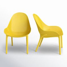 two yellow chairs sitting next to each other