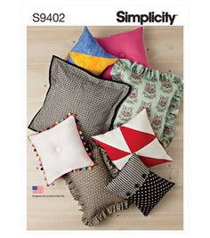 an image of pillows on the floor with different colors and patterns in them, including one for