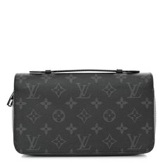 This is an authentic LOUIS VUITTON Monogram Eclipse Zippy XL Wallet. This stylish wallet is crafted of Louis Vuitton signature monogram on toile canvas in black and grey. The wallet features a smooth black leather top handle, and a polished ruthenium wrap-around zipper that opens to a partitioned black crossgrain leather interior with card slots, patch pockets, and a zipper compartment. Black Leather Top, Louis Vuitton Wallet, Leather Interior, Leather Top, Authentic Louis Vuitton, Louis Vuitton Monogram, Patch Pocket, Top Handle, Card Slots