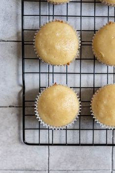 four muffins cooling on a wire rack