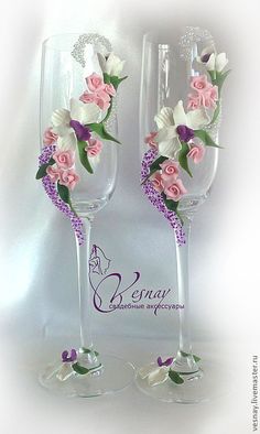 two wine glasses decorated with pink and white flowers