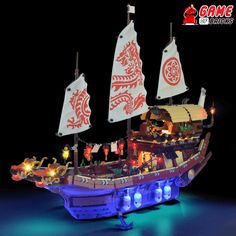 a lego pirate ship with lights and decorations on it's sails is shown in the dark