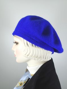 This women's warm and cozy gorgeous one of a kind royal blue French Beret Tam is a classic piece that never goes out of style. It's made of 100% wool that has been felted, creating a warm winter hat that keeps the cold air at bay. The color is a gorgeous, deep royal blue color. It is embellished with a handmade rosette made from hand dyed silk ribbon, vintage velvet leaves, vintage netting and vintage rhinestone buttons. One of a kind, unique and beautiful! ++++++++++++++++++++++++++++++++++++++ Blue Wool Hat For Winter, Winter Formal Felt Flat Cap, Formal Winter Flat Cap Felt Hat, Classic Blue Winter Hat, Formal Winter Felt Flat Cap, Fitted Blue Fall Hat, Fitted Winter Flat Cap Felt Hat, Classic Fitted Beret For Winter, Classic Fitted Beret With Curved Brim