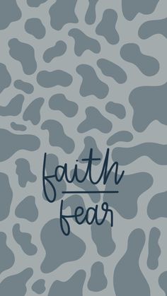 the words faith fear written in black ink on a gray leopard print background with an animal pattern