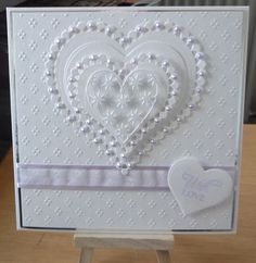 a white card with a heart on it