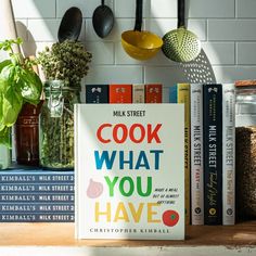 a cook book sitting on top of a wooden table