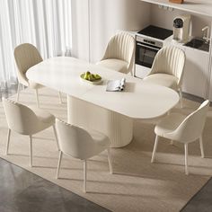 a white table with four chairs around it