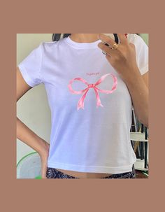 About Baby Tee: Embrace your playful side with our "I'm Just a Girl" Baby Tee! Perfect for those who love a cute and casual aesthetic, this baby tee is a must-have addition to your wardrobe. - 100% Cotton - Midweight fabric - Classic fit - US cotton - Without side seams: Knit in one piece using tubular knit, it reduces fabric waste and makes the garment more attractive - Ribbed knit collar without seam: Ribbed knit makes the collar highly elastic and helps retain its shape - Shoulder tape: Twill Cute Pink T-shirt With Custom Print, Pink Y2k Tops With Custom Print, Pink Y2k Style Top With Custom Print, Y2k Pink Top With Custom Print, Cute White Tops With Text Print, Cute White T-shirt With Letter Print, Cute White Short Sleeve T-shirt, Cute White Screen Print Top, Cute Short Sleeve T-shirt With Custom Print