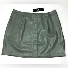 Elevate Your Wardrobe With This Stunning Green Vegan Leather Mini Skirt From Lulus. This Skirt Features A Button-Front Closure And A Zip For Easy Wear. The Solid Pattern And Short Length Make It A Stylish Choice For Any Occasion. Crafted From High-Quality Faux Leather, This Skirt Is Both Durable And Comfortable. It's Perfect For Women Who Want To Add A Touch Of Sophistication To Their Outfits. The Size L Skirt Is Designed To Fit Regular Size Types And Is Sure To Become A Favorite In Your Wardrob Lulu Skirt, Gold Mini Skirt, Navy Mini Skirt, Chambray Skirt, White Lace Skirt, Vegan Leather Skirt, Tiered Mini Skirt, Wrap Mini Skirt, Faux Leather Mini Skirt