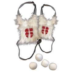 a pair of white and red ear muffs next to three balls on a string