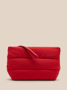 So puffy.  This cute clutch has an extra sporty look and a zip-top closure that doubles as a wrist strap for easy carrying.  Zip top closure.  Internal pocket.  Fully lined.  Height: 7. 5" (19cm) Width: 14. 7" (37cm) Depth: 3" (7. 5cm) Leather trim. Puffy Makeup Bag, Casual Clutch With Zipper Closure For Everyday Use, Casual Everyday Clutch With Zipper Closure, Red Bag Outfit, Puffy Bag, Cos Bags, Pr Kit, Puffer Bag, Red Sunset