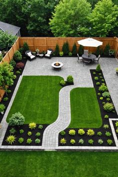 an aerial view of a backyard garden with lawn, patio and seating area in the middle