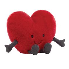 a heart shaped pillow with two legs