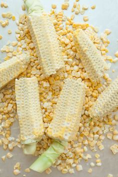 corn on the cob with kernels and celery sitting next to it