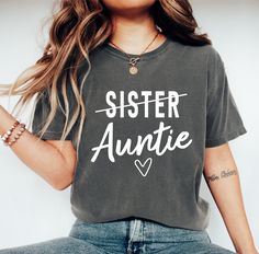 Sister To Auntie Comfort Colors Shirt, Aunt T-Shirt, Gift For Auntie, Pregnancy Announcement Shirt, Aunt Gift, Auntie Reveal Tee, Aunt To Be Welcome to BelinayShirt,  Your ultimate destination for unique and stylish printed t-shirts! At BelinayShirt, we believe in expressing individuality through fashion. Our collection features a wide range of designs, from trendy graphics and bold statements to artistic prints and personalized options. Each shirt is crafted with high-quality materials to ensure comfort and durability. Whether you're looking to make a fashion statement or find the perfect gift, BelinayShirt has something for everyone. Discover your new favorite tee today and wear your personality with pride! Auntie Pregnancy Announcement, Aunt To Be, Trendy Graphics, Aunt T Shirts, Auntie Shirts, Bold Statements, Aunt Shirts, Pregnancy Announcement Shirt, Comfort Colors Shirt