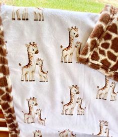 a baby blanket with giraffes on it