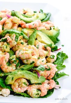 shrimp and avocado salad on a white plate