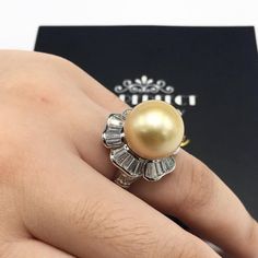 GOLDEN SOUTH SEA PEARL, absolutely natural color and luster, 13.5 mm in size, surrounded by 48 pieces of hand-set F/VS superb quality diamonds, weighting at 1.38 carats. Set in handcrafted, one of a kind 18K solid white gold ring, weighting at 11.0 grams. The pearl is naturally cultured from South Australia Sea, its luster is EXTREMELY fine, AA+ grade with 90% clean surface. SUGGESTED RETAIL PRICE: $7,800 The ring is hand crafted to a high standard and is NOT mass machine produced and is brand n Elegant Yellow Flower Shaped Ring, Elegant Yellow Flower-shaped Ring, Golden South Sea Pearls, Flower Handmade, Sea Pearl, Vs Diamond, South Seas, Sea Pearls, South Sea Pearls