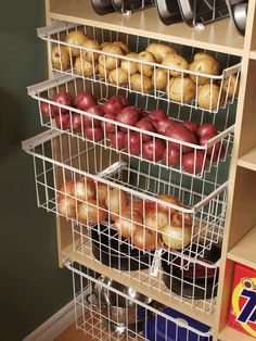 the shelves are filled with apples and other foods