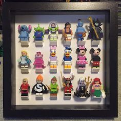 a shadow box frame with lego minifigures in it