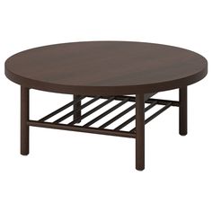 a round wooden table with metal rack underneath it