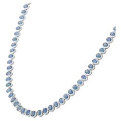 This is part of Chairish’s Fine Jewelry assortment.  Blue Sapphire Necklace in 18K Gold studded with oval cut sapphire pieces. Accessorize your look with this elegant blue sapphire beaded necklace. This stunning piece of jewelry instantly elevates a casual look or dressy outfit. Comfortable and easy to wear, it is just as exquisite worn alone or layered with other charms for a modern fashion statement.  PRODUCT DETAILS :-  > Material - 18K Solid White Gold  > Gemstone - Blue Sapphire  > Gemstone Gold Gemstone Necklace, Dressy Outfit, Blue Sapphire Necklace, Blue Sapphire Gemstone, White Gold Sapphire, Sapphire Wedding, Tennis Necklace, Modern Necklaces, Sapphire Necklace