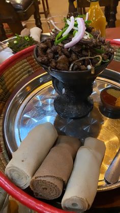 an assortment of food items on a metal platter