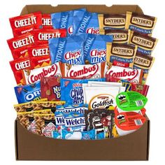 an open box filled with snacks and candy bar wrappers on top of each other