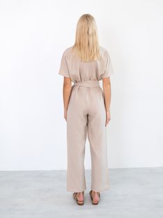 "AURORA is a short sleeve jumpsuit with belt. DETAILS - Wrap style top - Dolman sleeves - Self tie belt - 100% lightweight European linen fabric - Cut and sewn to order just for you in our studio COLOR - Beige, you can also choose other colors above - Fabric samples are available here https://www.etsy.com/listing/586569696/linen-fabric-samples SIZING & FIT - Fits true to size - Inseam is approximately 28.5 inches / 72 cm - Bust is approximately 21 inches / 49.5 cm - Waist is approximately 18 Chic Belted Short Sleeve Jumpsuit, Summer Workwear Belted Jumpsuits And Rompers, Chic Belted Jumpsuit With Short Sleeves, Chic Belted Short Sleeve Jumpsuits And Rompers, Summer Workwear Jumpsuits And Rompers With Belt, Chic Belted Jumpsuits And Rompers With Short Sleeves, High Waist Belted Jumpsuits For Workwear, Summer Workwear Jumpsuits With Short Sleeves, Summer Beige Belted Jumpsuits And Rompers