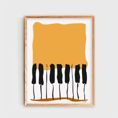 an abstract art print with black and yellow piano keys on white paper in a wooden frame