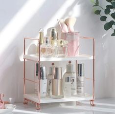 a shelf with cosmetics and other items on it