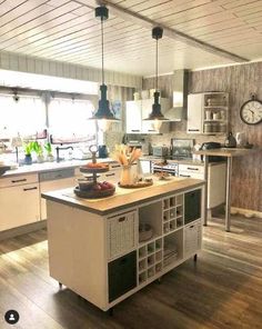 a kitchen with a center island and lots of counter space