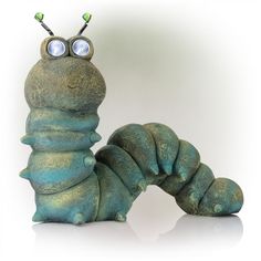 a blue caterpillar with two eyes sitting on top of it's back