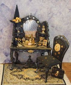 a miniature table with a mirror, chair and other items