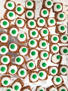 green and white pretzels are arranged on tin foil