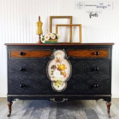 an old dresser with flowers painted on it