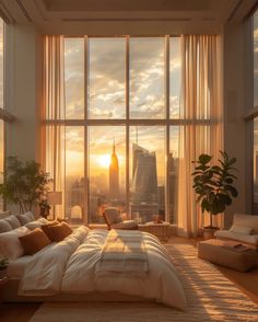 a bedroom with a large window overlooking the city at sunset or sunrise, it is very nice