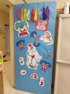 a door decorated with dr seuss and cat in the hat stickers on it