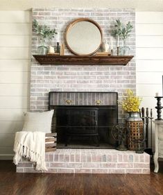 a brick fireplace with a mirror above it