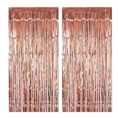 two large pink tinsele curtains with fringes on the sides and one in the middle