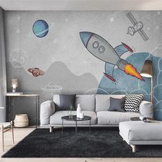 a living room filled with furniture and a mural on the wall that has an image of a rocket ship flying through space